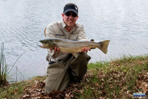 Warren with a brown trout caught during the festival